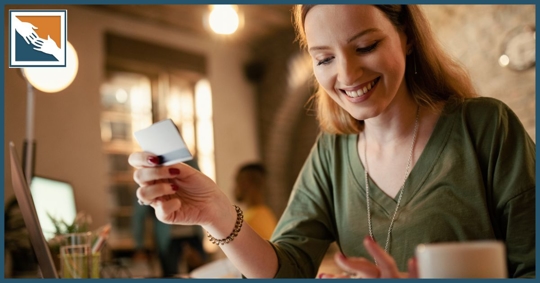 Woman with a credit card looking to make an online purchase